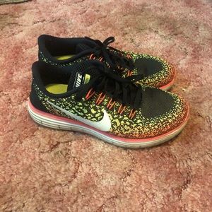 Women Nike running tennis shoes.